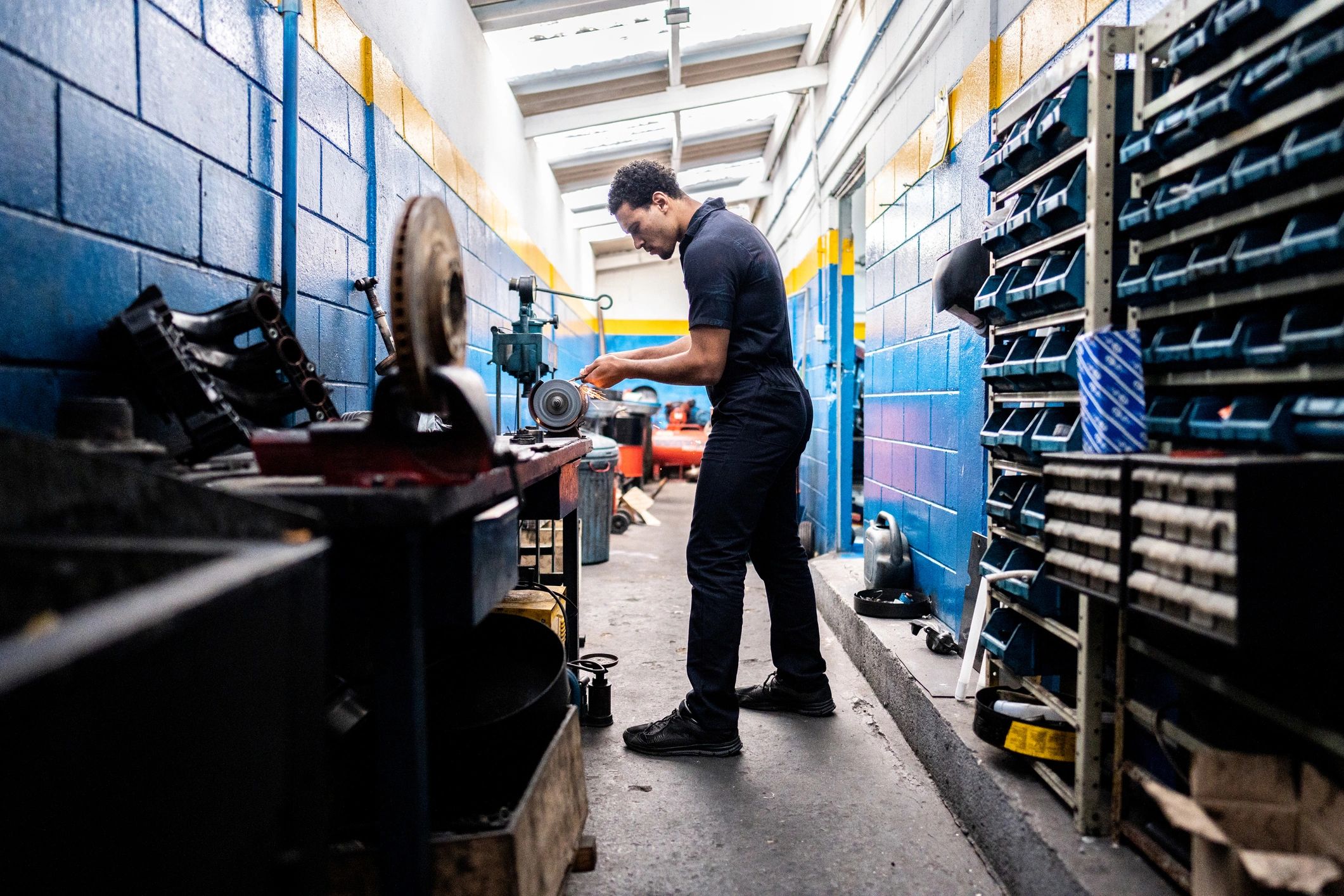 Technician working on industrial equipment in a workshop